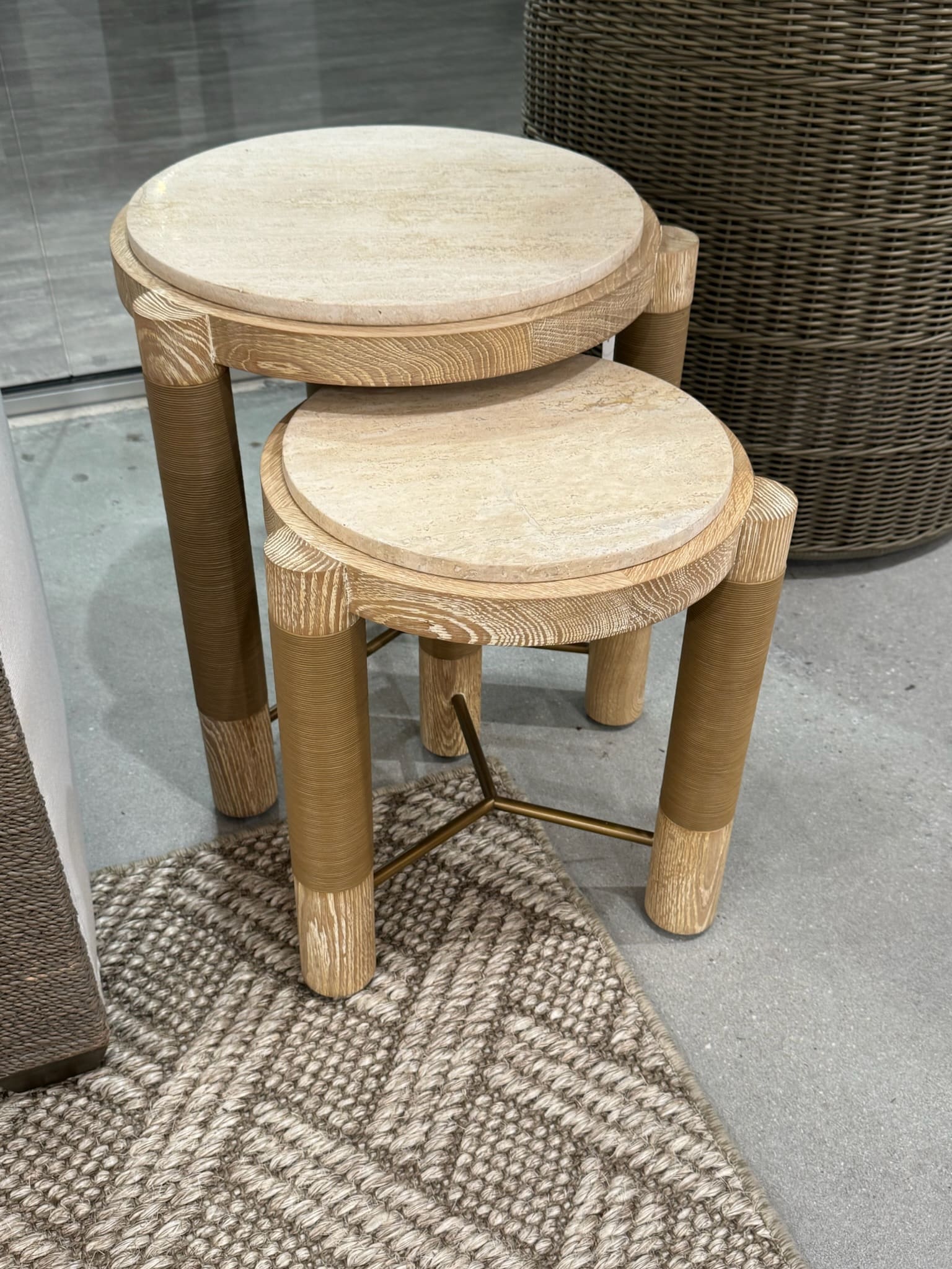 Burl wood nesting tables travertine tops High Point Market 2026 Baker Design Group Dallas luxury interior design trends